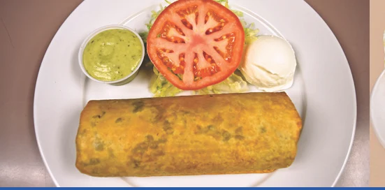 Burrito plate with guacamole and sour cream