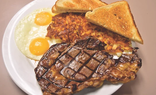 Steak and eggs with hash browns and toast